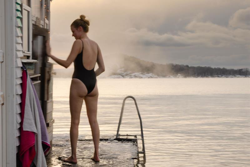 A lady going for a swim during winter
