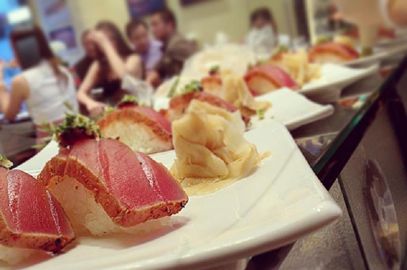 sushi with guests in the background