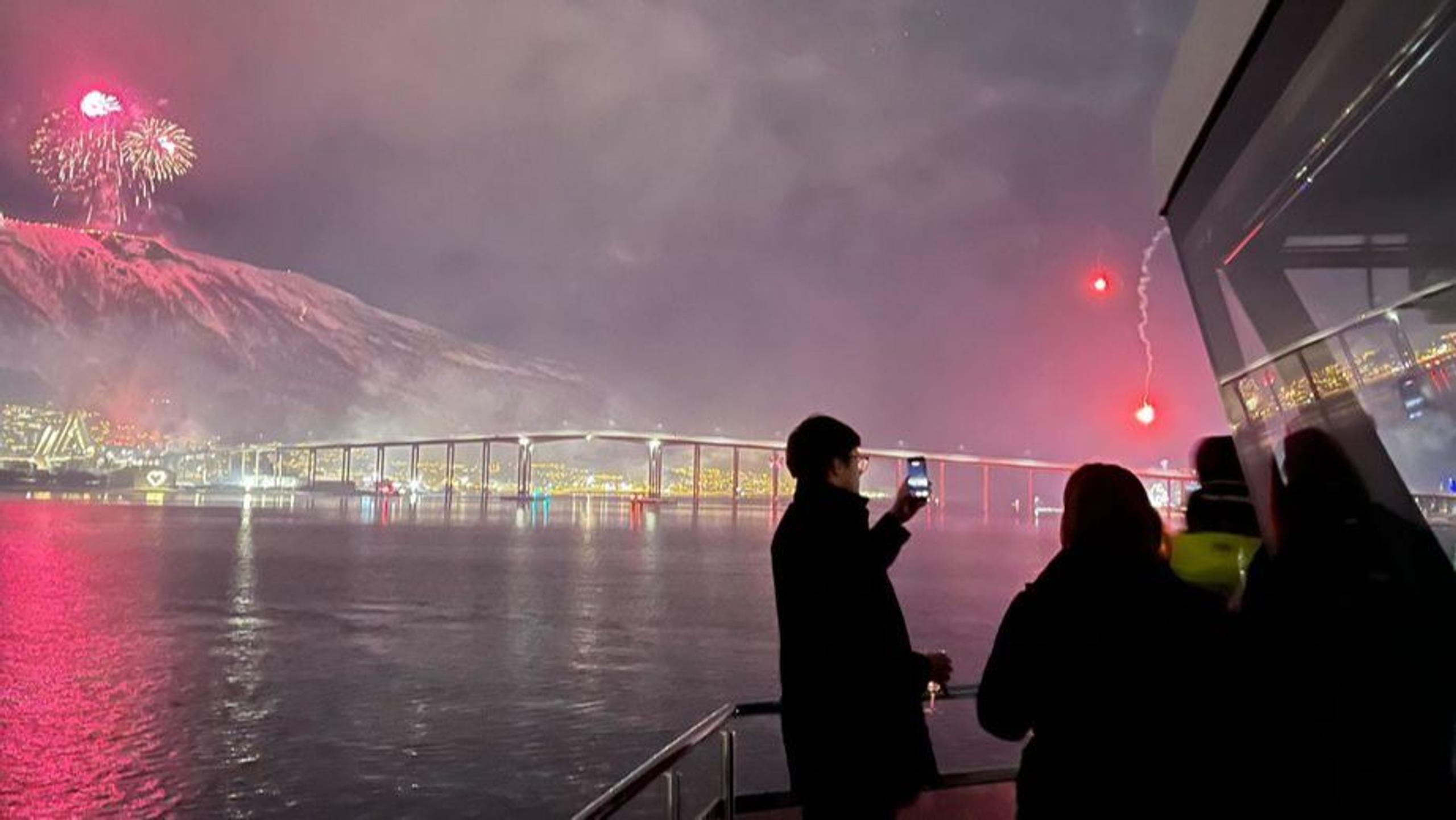 The Tromsø bridge and fireworks from th Cable Car