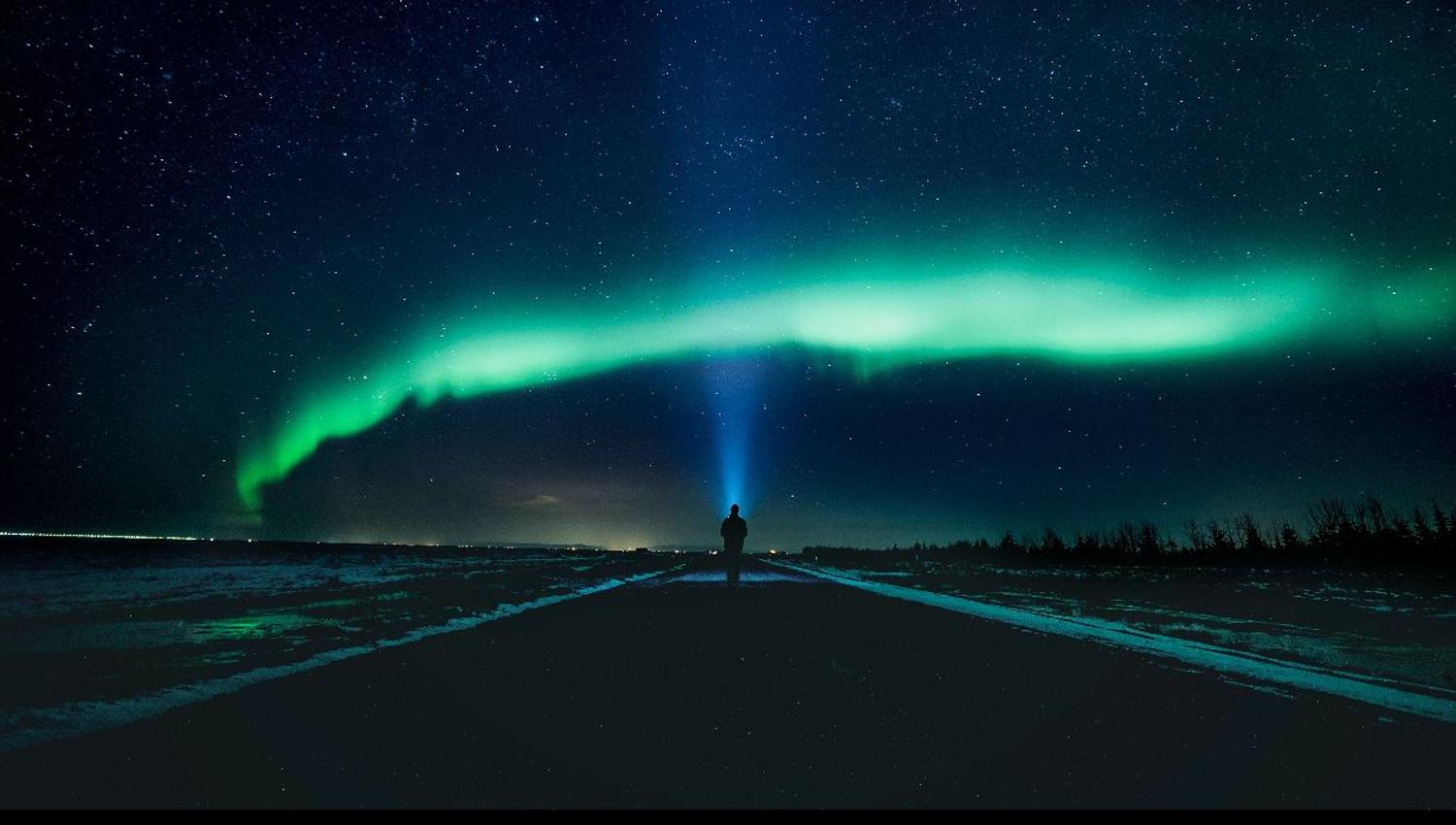Person under the northern lights