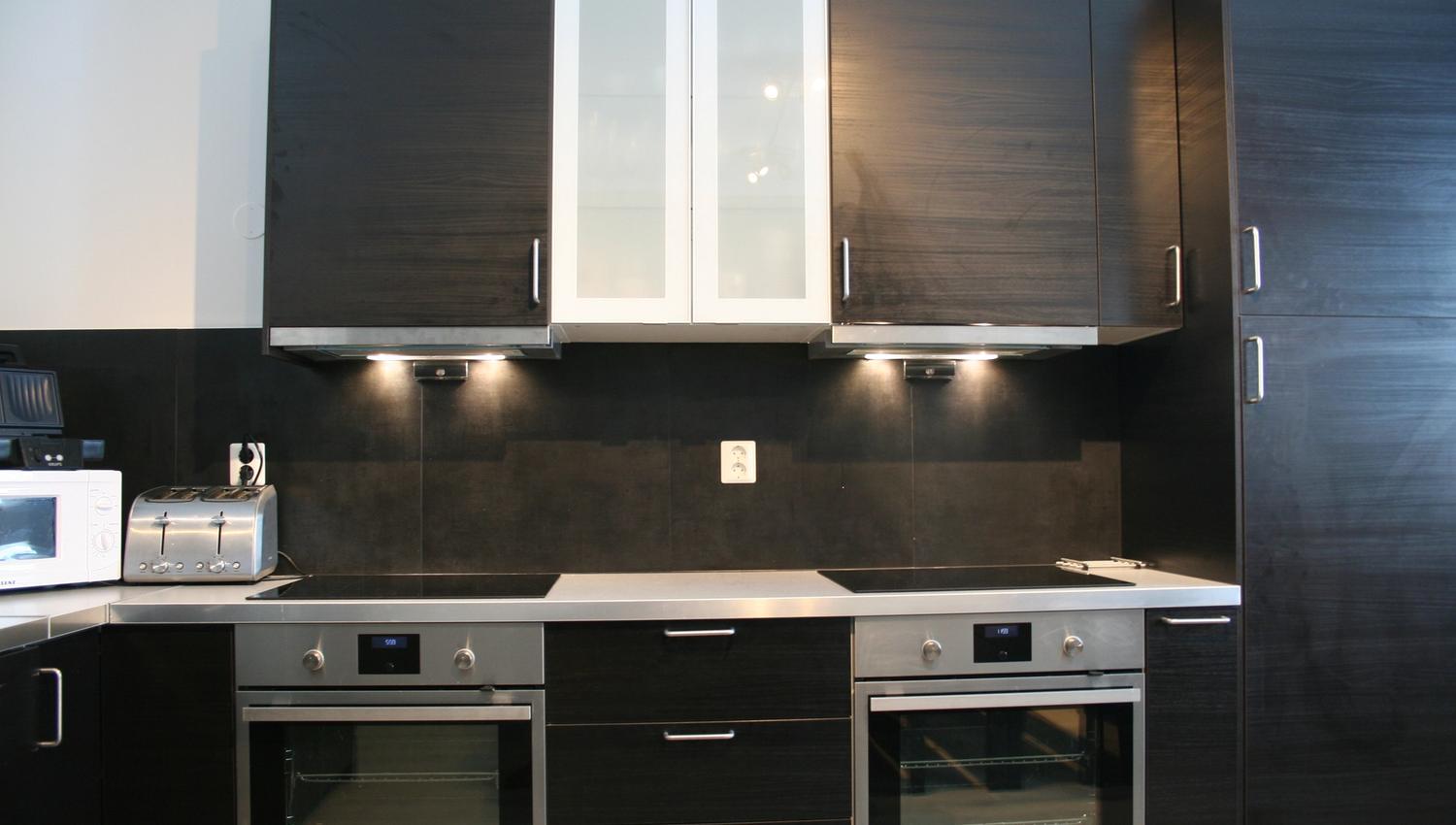 Sleek modern kitchen at Kvamseter Lodge with dual ovens and full cooking facilities.
