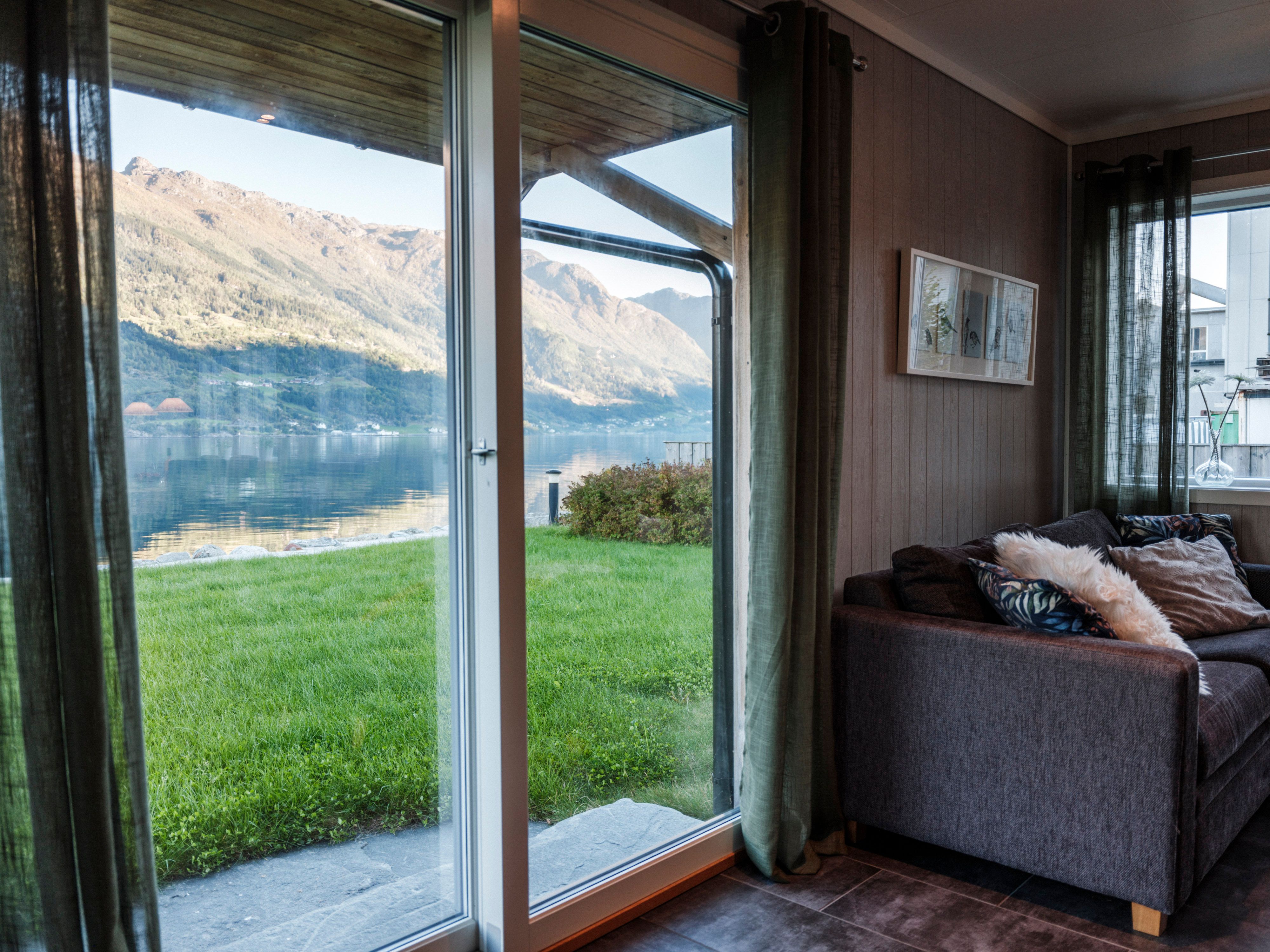 Panoramic view from Aga Fjordapartments of the Hardangerfjord in the evening sun.