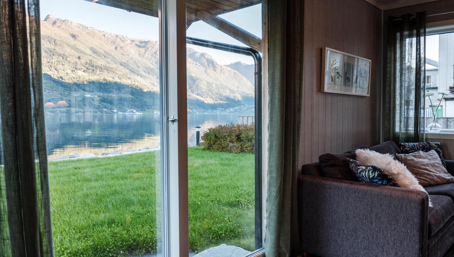 Panoramic view from Aga Fjordapartments of the Hardangerfjord in the evening sun.
