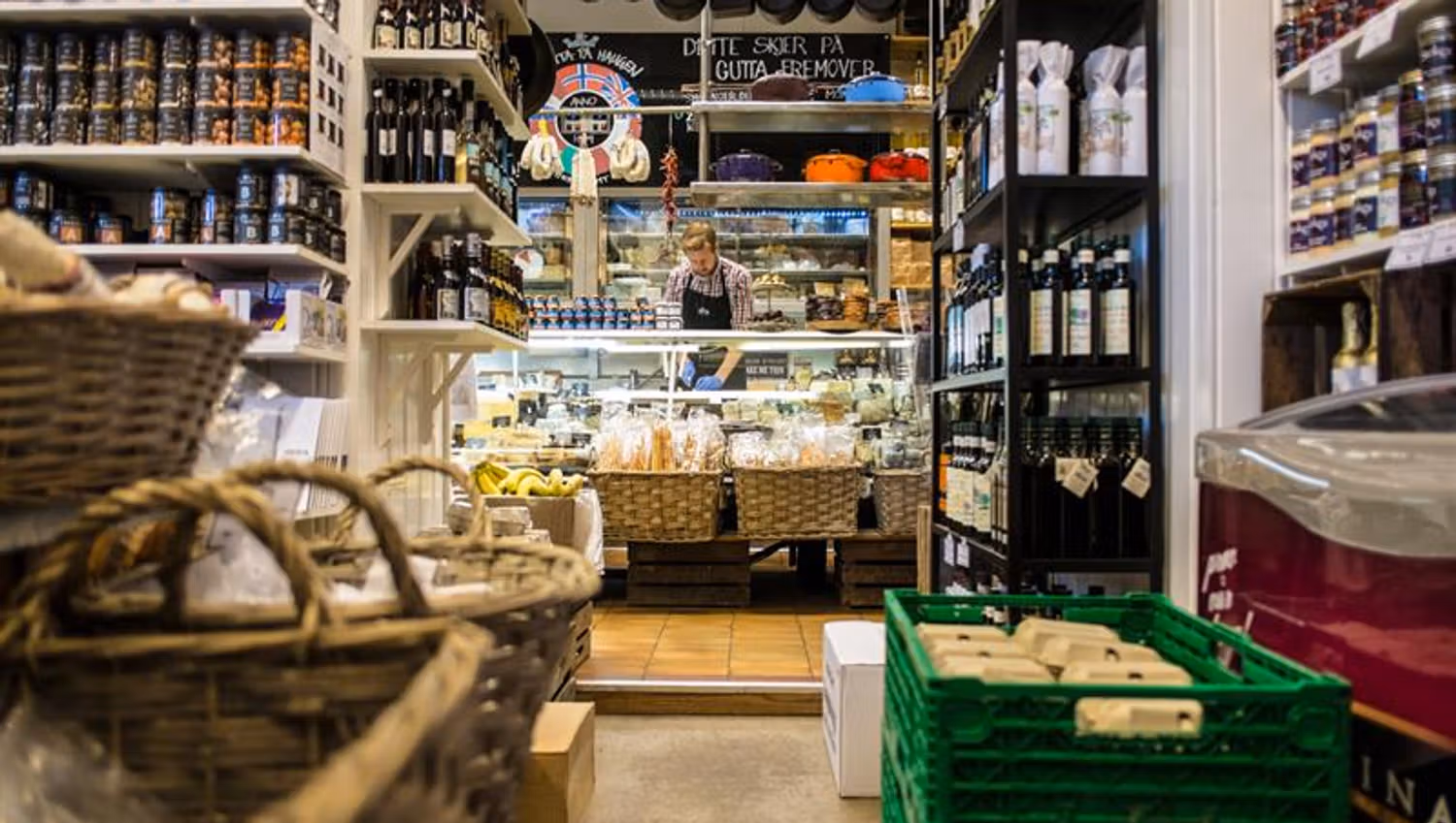 Shop interior: Lots of exciting wares to purchase, employee standing behind the counter.