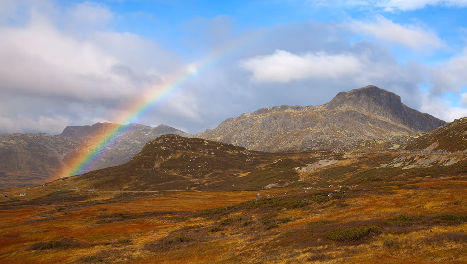 The mountain Bitihorn behind a rainbow