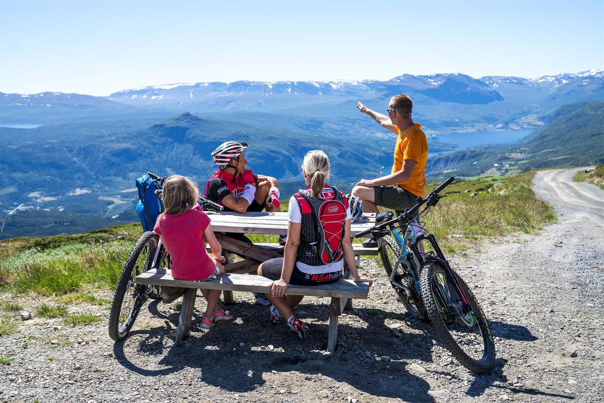 Rest at the highest point of the mountain pass road Slettefjellvegen with a breathtaking view into the valley below and mountains far behind.