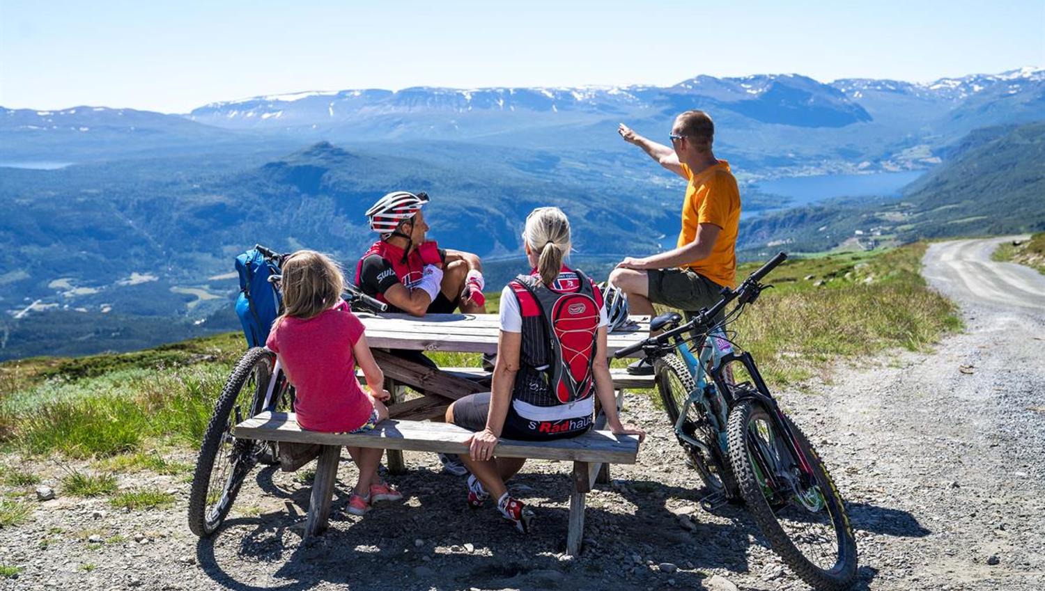 Rest at the highest point of the mountain pass road Slettefjellvegen with a breathtaking view into the valley below and mountains far behind.