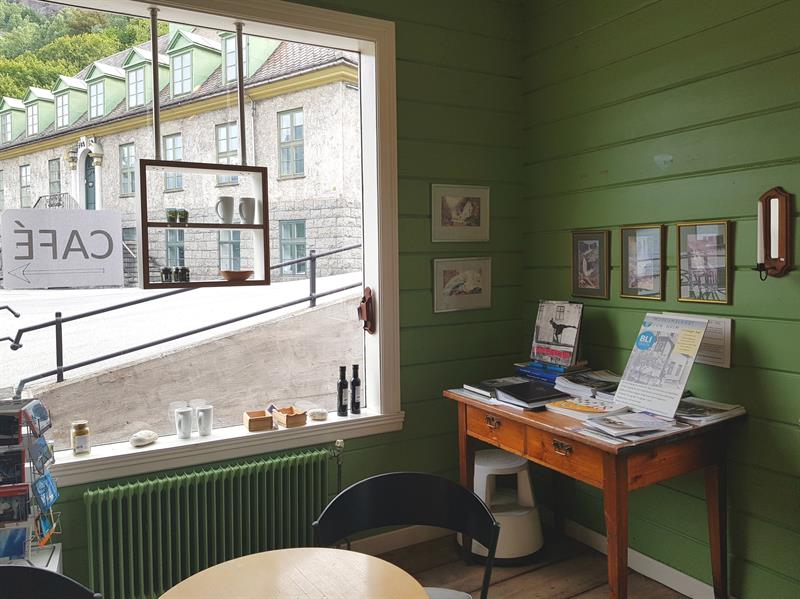 Café area at the Kraftmuseet, overlooking the museum grounds with souvenirs available for visitors.