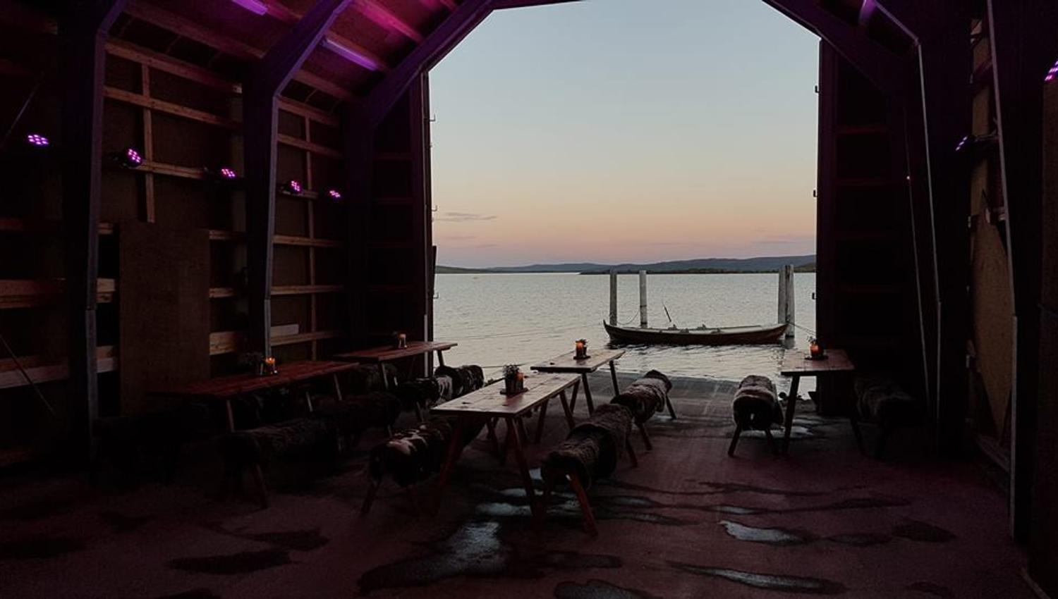 View from a boat house on Halne, with a pink sky in the background.