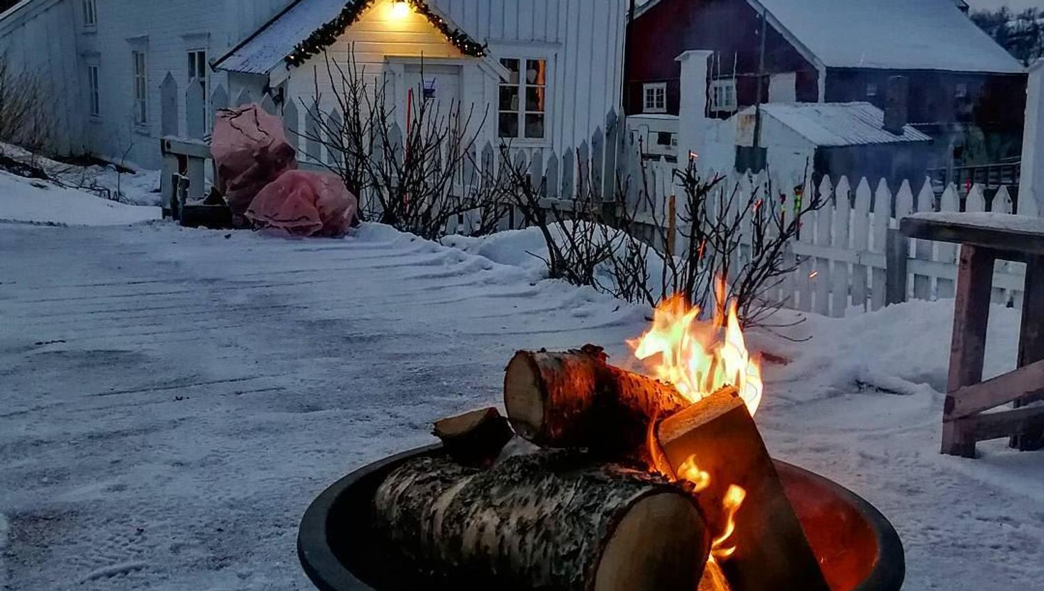 winter photo, outdoors of the venue, with a bonfire
