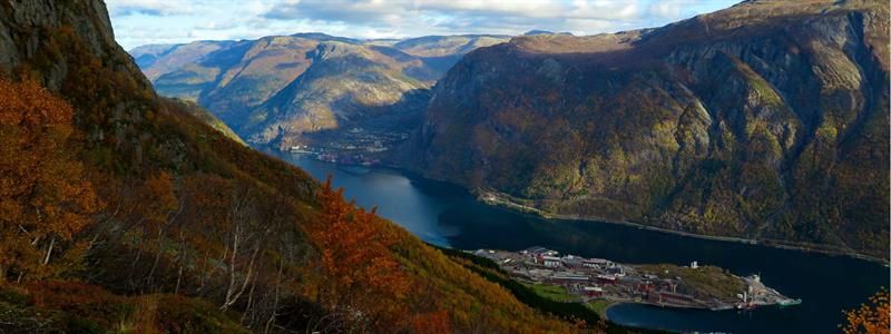 Panoramic view from Tokheimslia overlooking Sørfjorden and the mighty Hardanger mountains glowing in autumn colours.