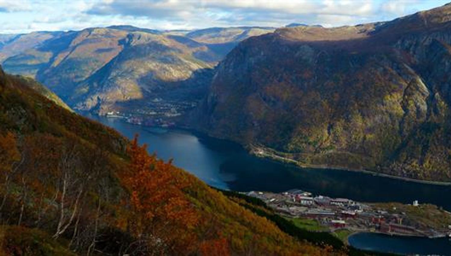 Panoramic view from Tokheimslia overlooking Sørfjorden and the mighty Hardanger mountains glowing in autumn colours.
