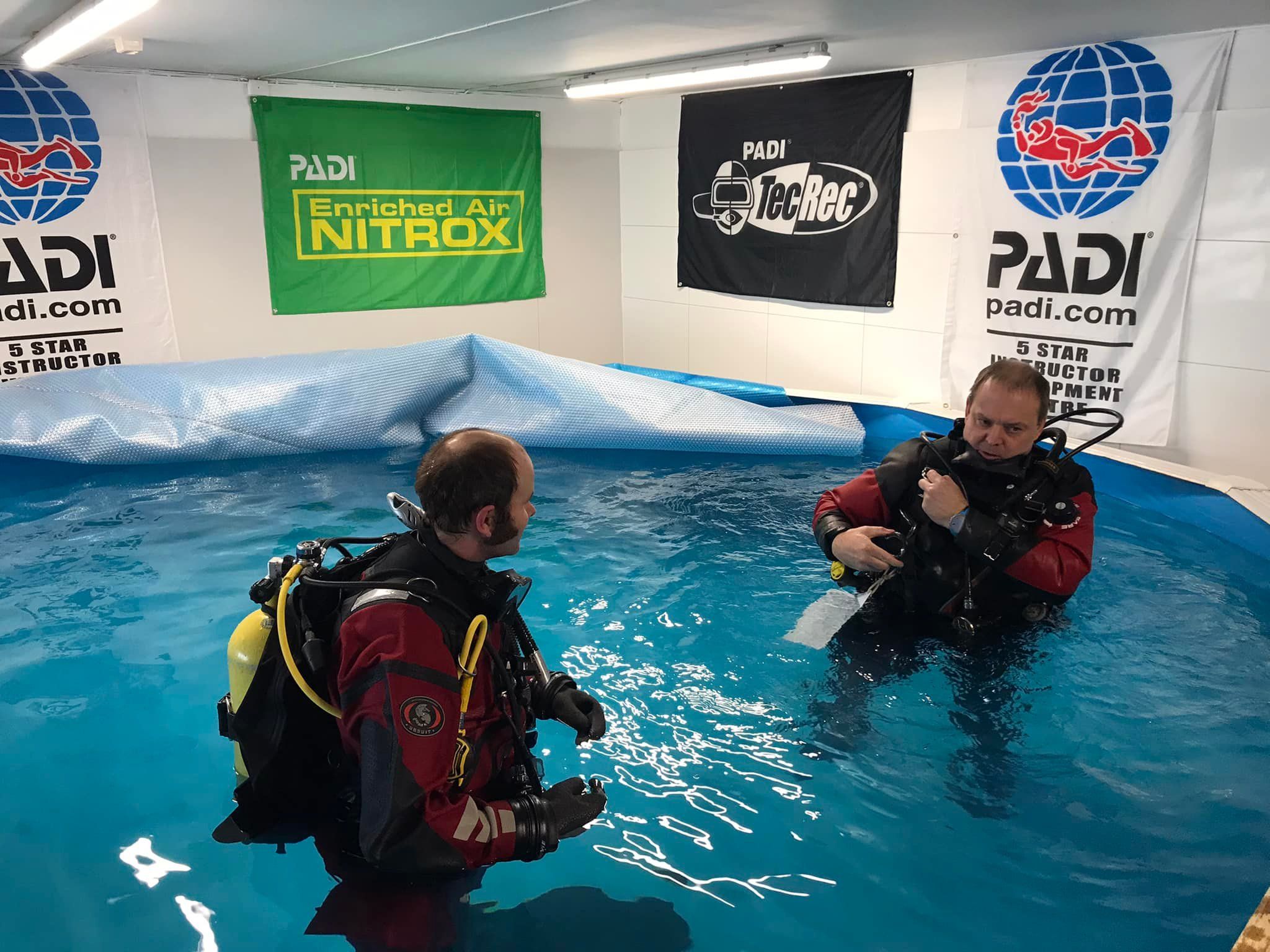 Two divers in the training pool
