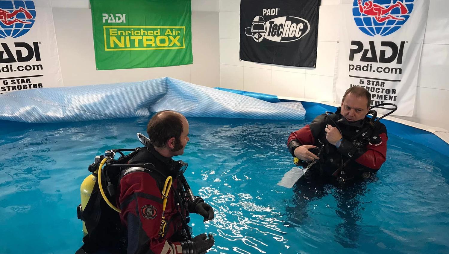 Two divers in the training pool