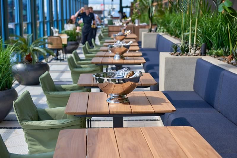 Table with seating section and champagne in a bucket
