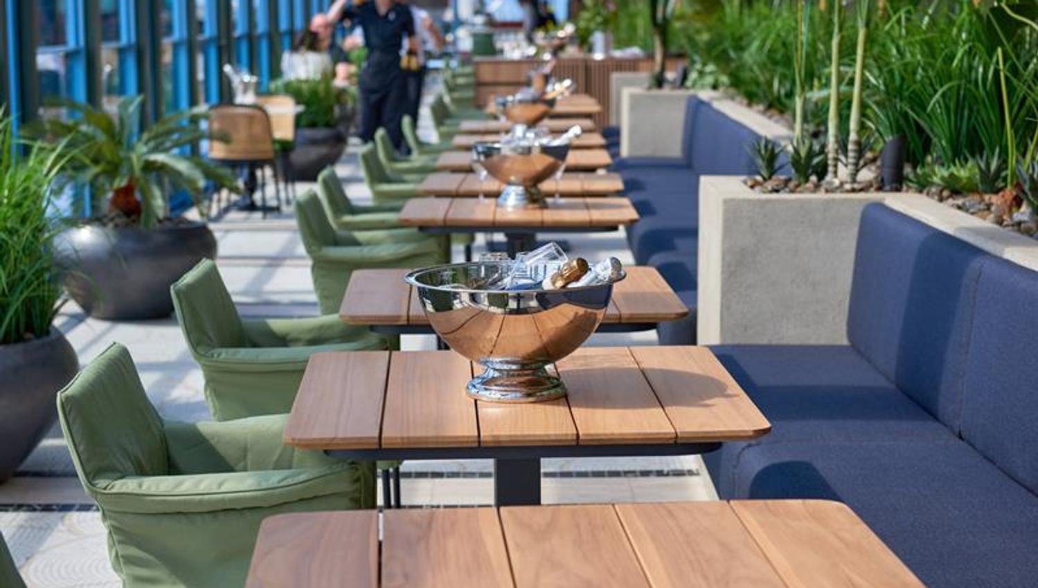 Table with seating section and champagne in a bucket