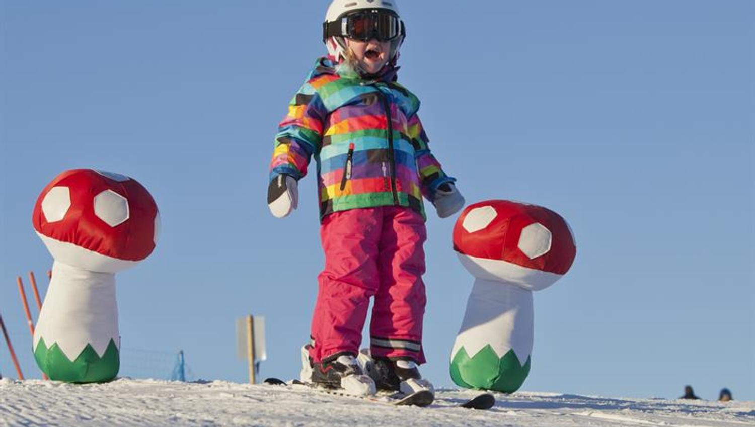 child on ski