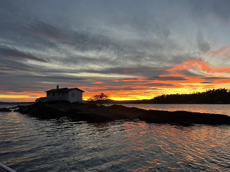 Sunset at the fjord with red and yellow sky