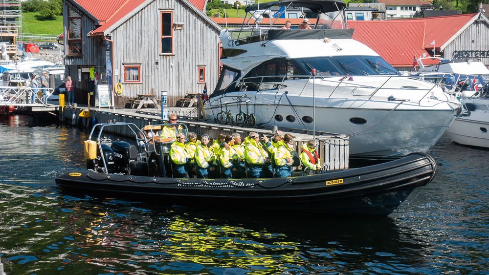 A group of adventurous tourists ready for an action-packed RIB safari from Norheimsund in Hardanger.