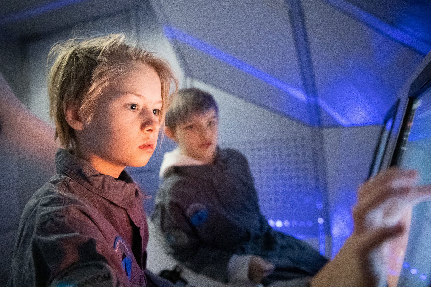 Kids playing and exploring the spaceship