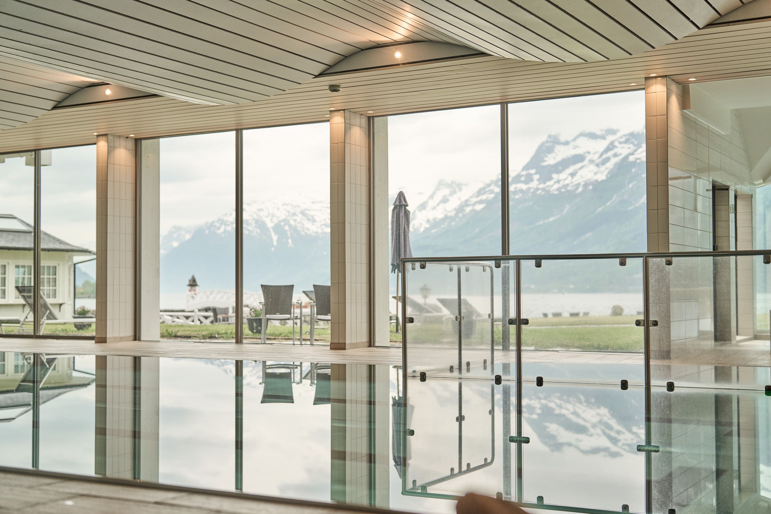 Quiet and clean pool area with fjord view from the indoor pool at Hotel Ullensvang.