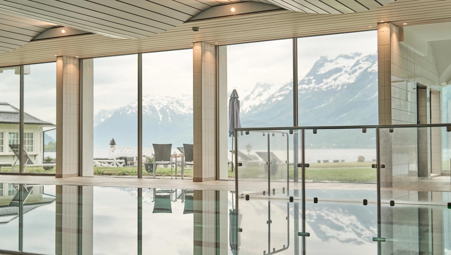 Quiet and clean pool area with fjord view from the indoor pool at Hotel Ullensvang.