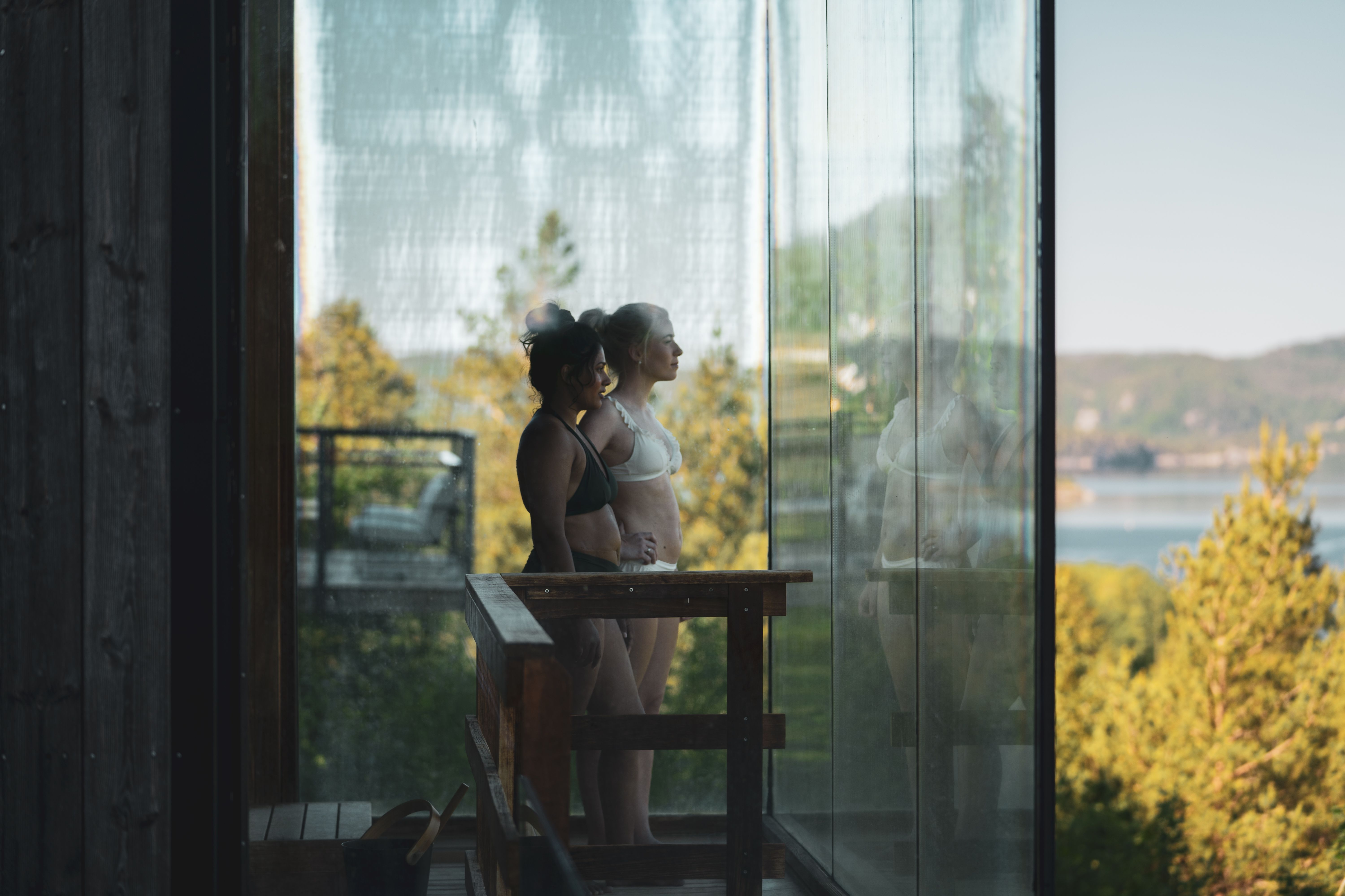 Girls in the sauna enjoy the nice view
