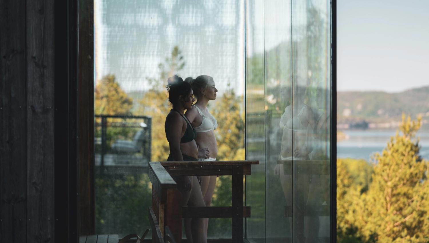 Girls in the sauna enjoy the nice view