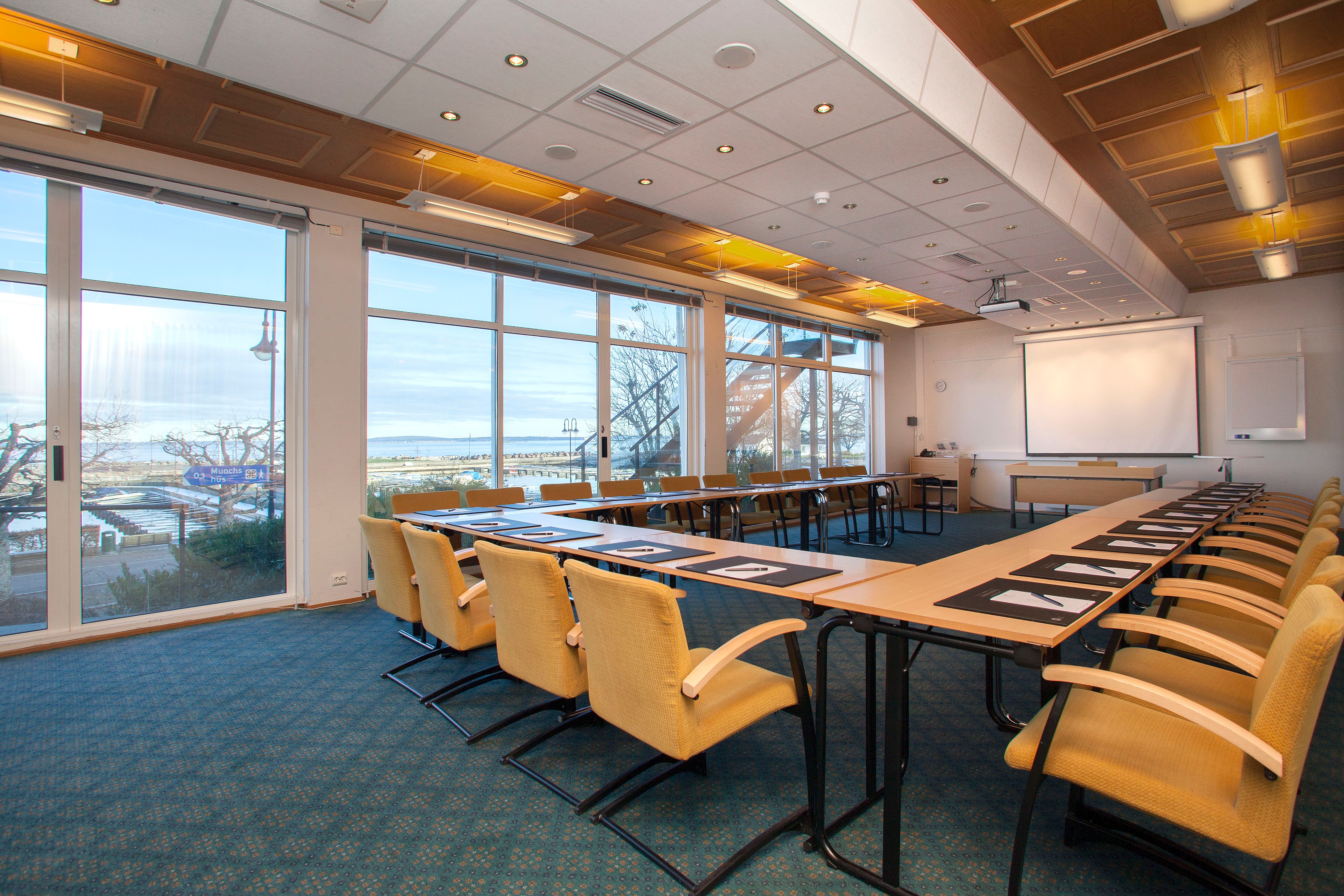 Meeting room with table and yellow chairs
