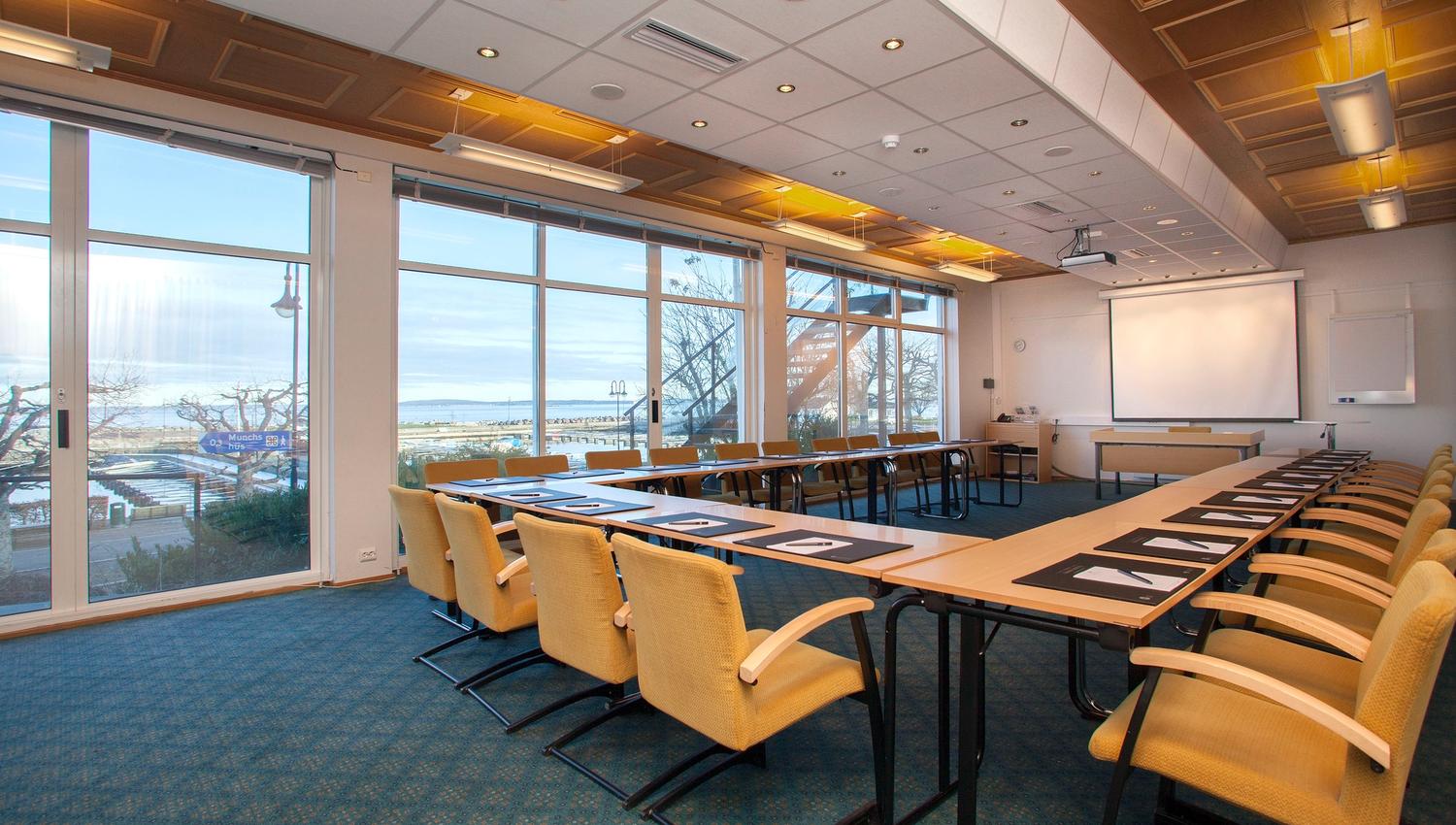 Meeting room with table and yellow chairs