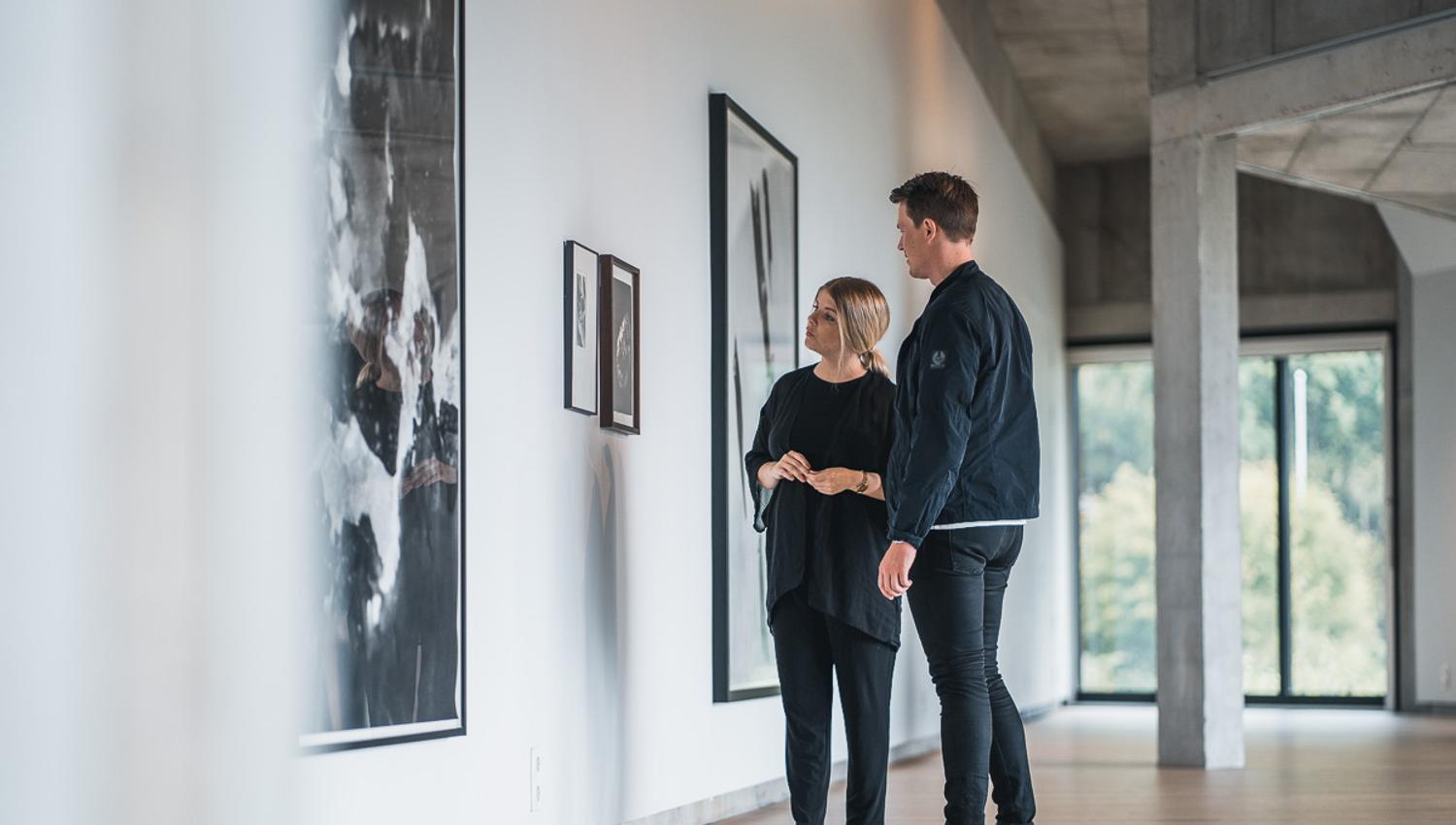 Visitors observing contemporary art on display at the Kabuso Art House.
