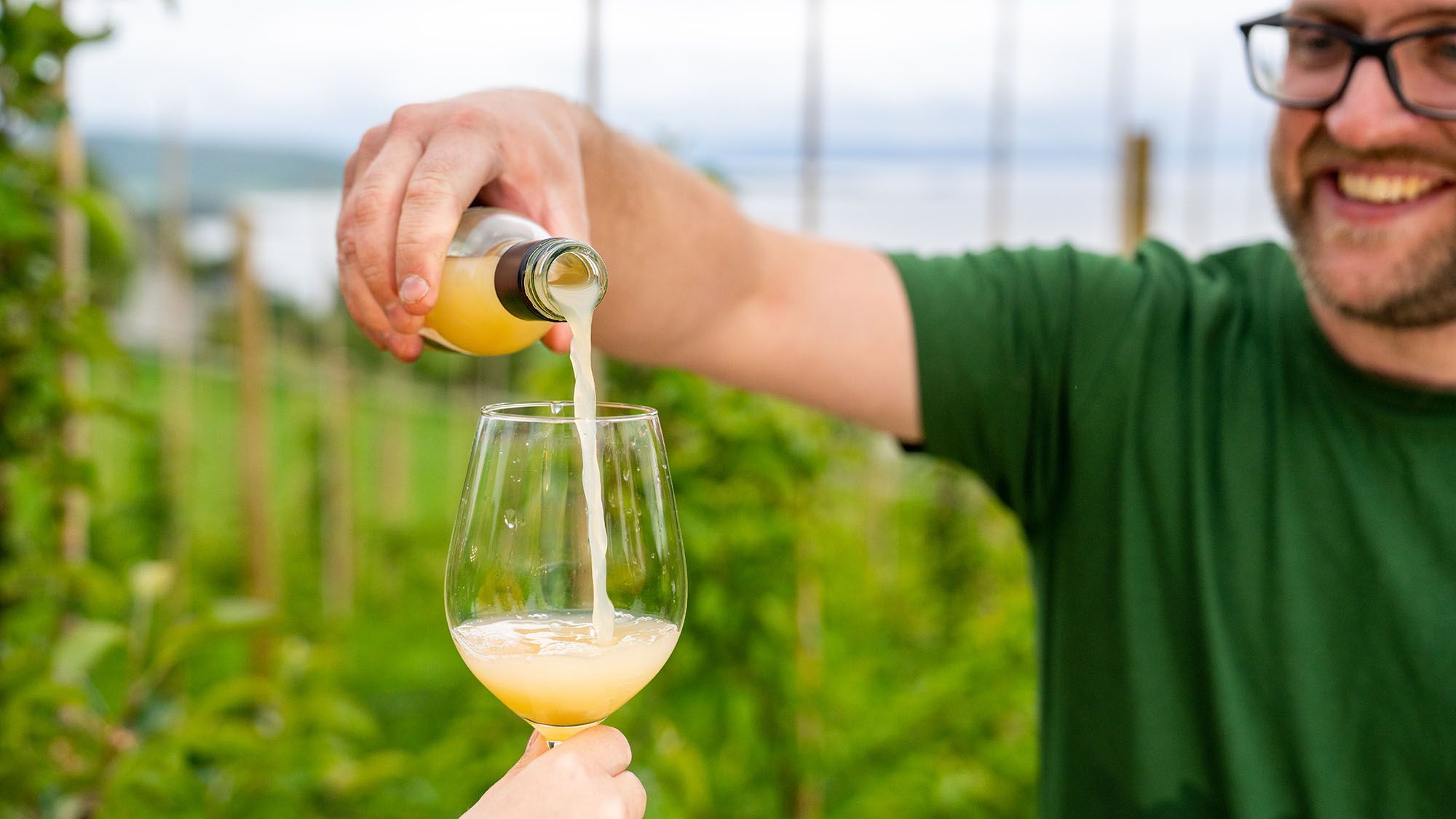 Pouring apple juice into glass
