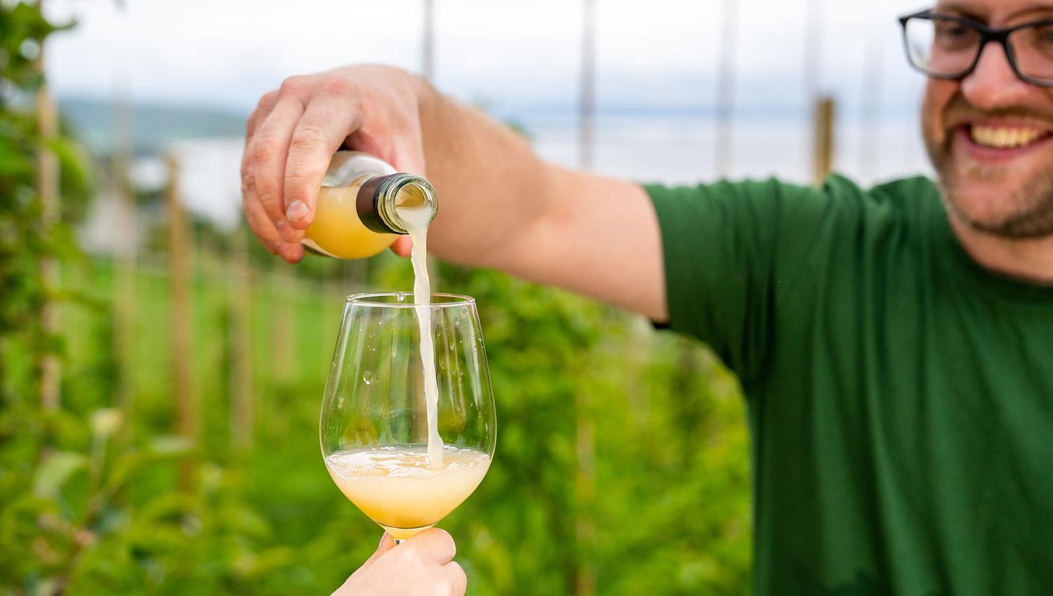 Pouring apple juice into glass