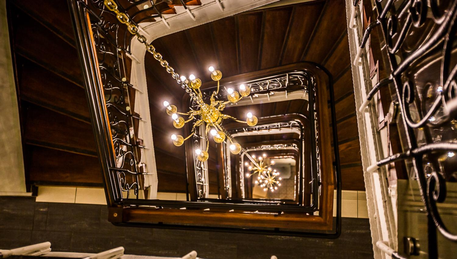 19th century staircase. Wood and iron. Saga Hotel & Poshtel Oslo Central. Photo