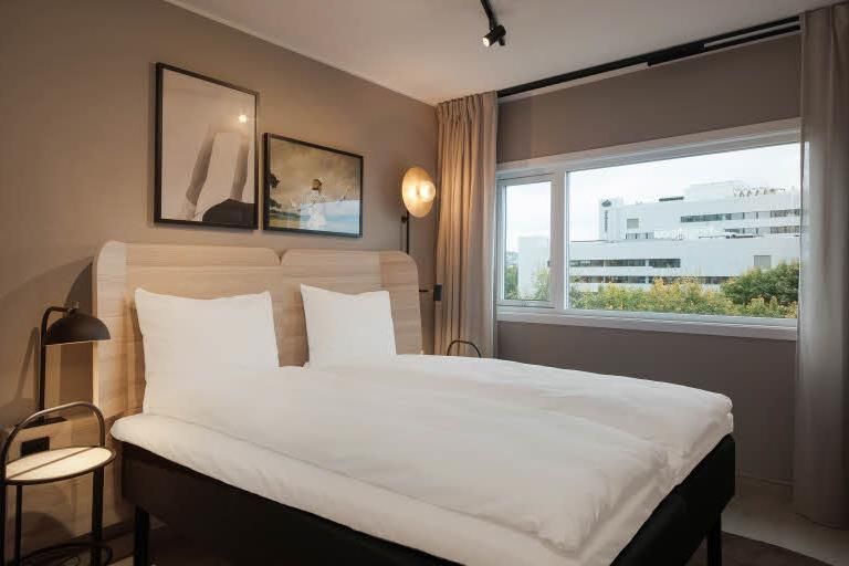 Bed in a standard room at Scandic Helsfyr