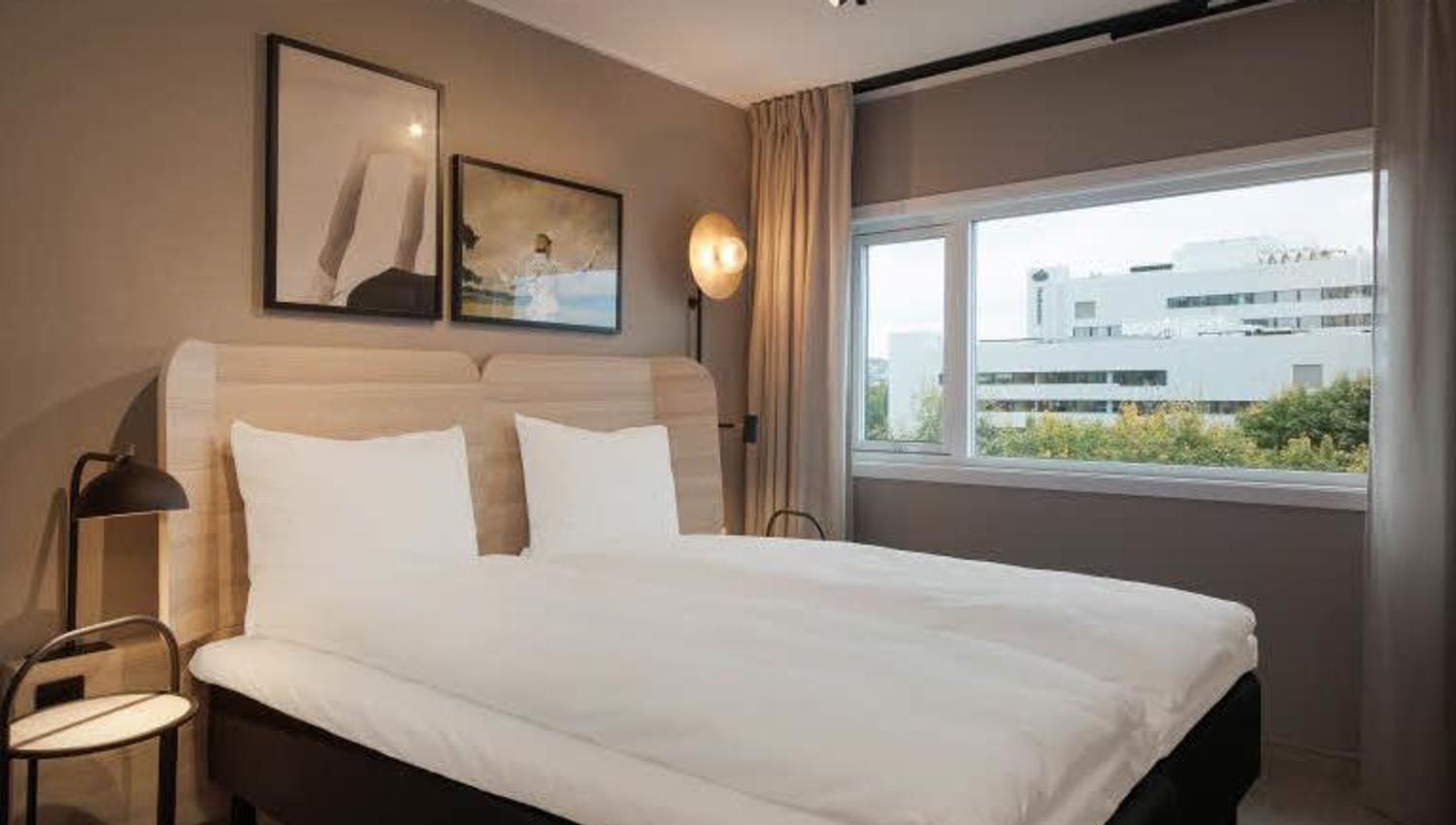 Bed in a standard room at Scandic Helsfyr