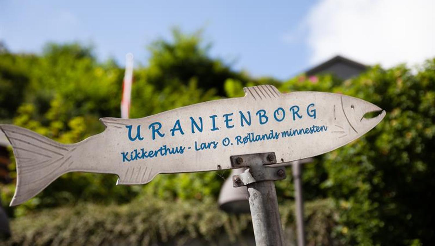 Sign shaped like a salmon with blue lettering “Uranienborg”