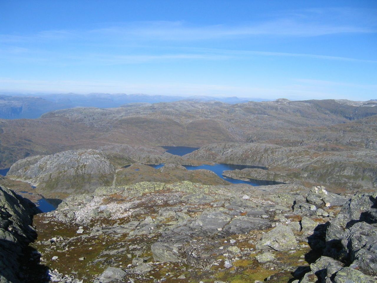 a view towards mountains and mountain lakes 