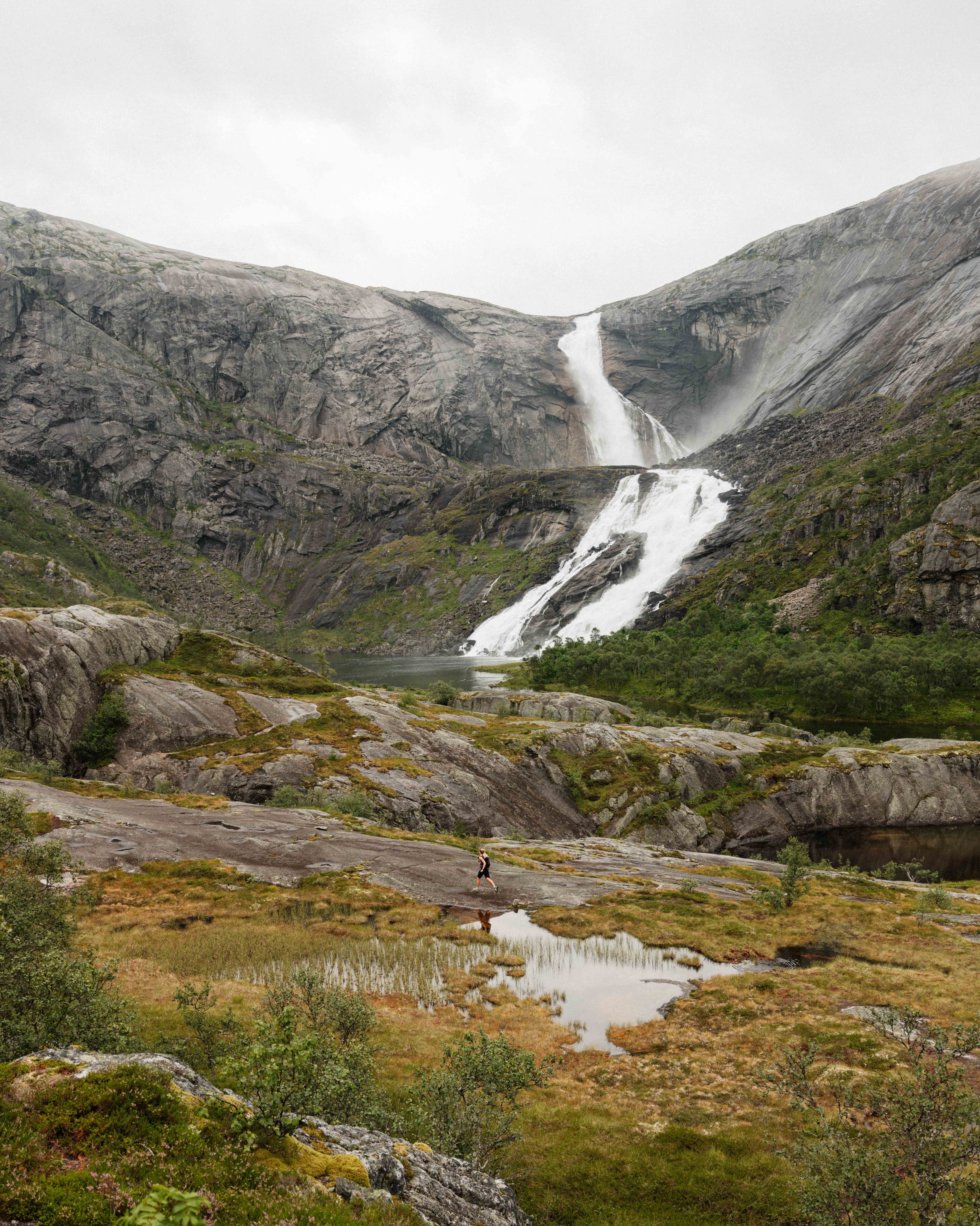  A hiker approaches Nyastølsfossen – a majestic waterfall at the upper end of the Husedalen Valley.