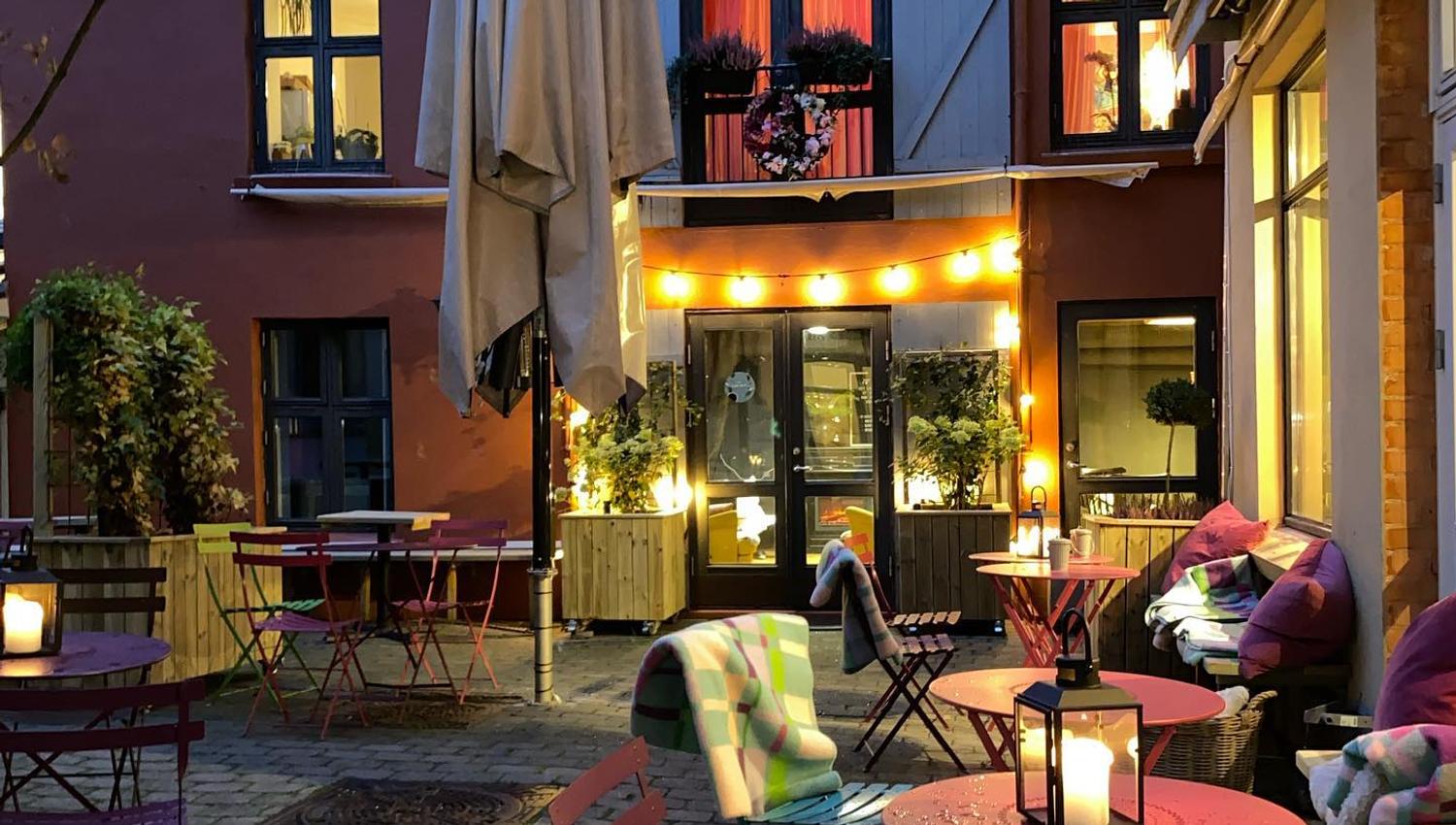 Backyard with pink table and chairs