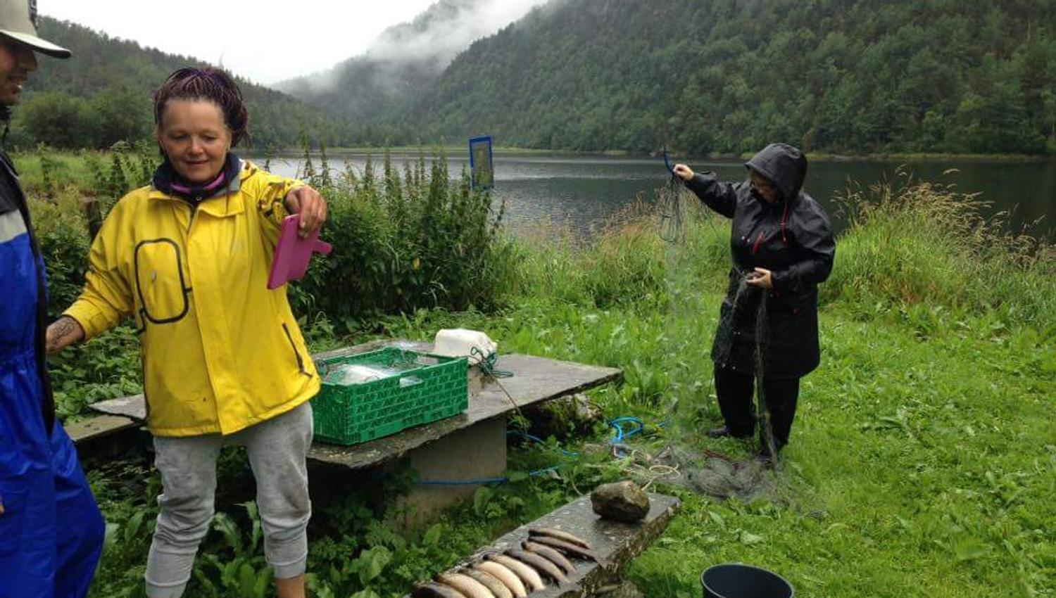 Guests enjoying fishing by the lake near Folgefonn Farm Camping – a true Hardanger experience.