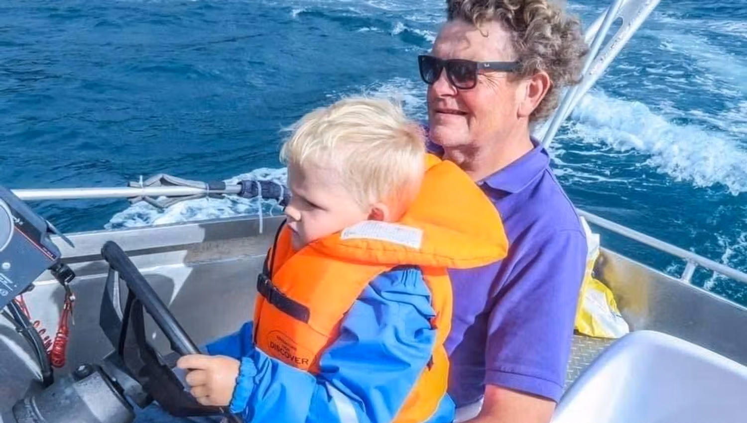 Man and child on a boat