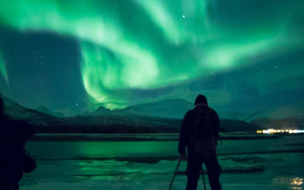 Northern Lights above shine and light up the ground