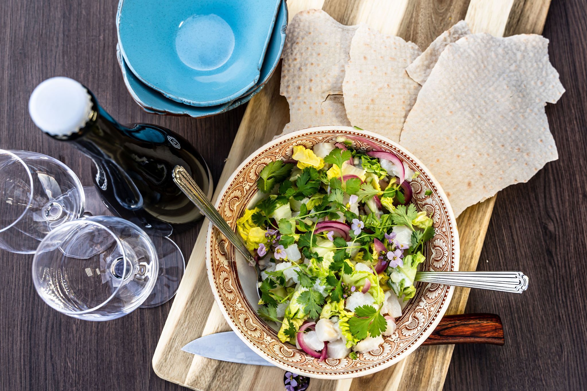 Fresh and colorful salad served with traditional flatbread.