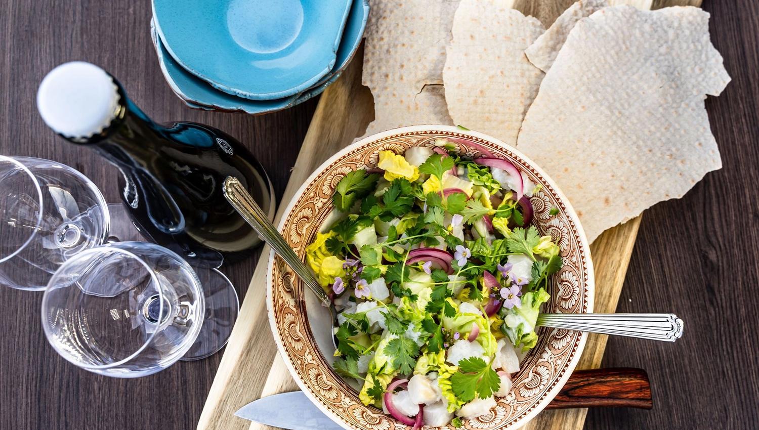 Fresh and colorful salad served with traditional flatbread.