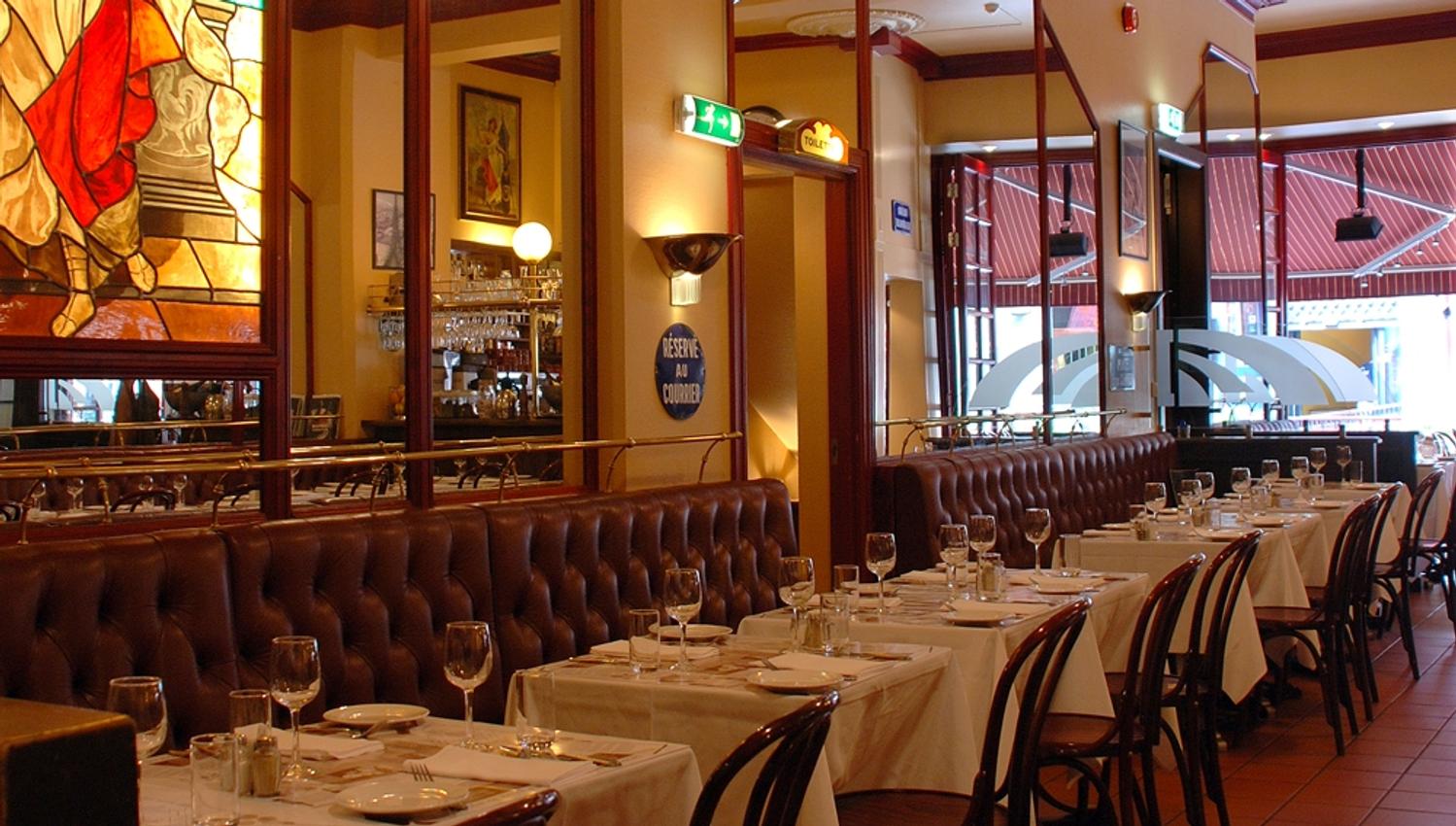 Interior photo of tables, chairs and seating section.