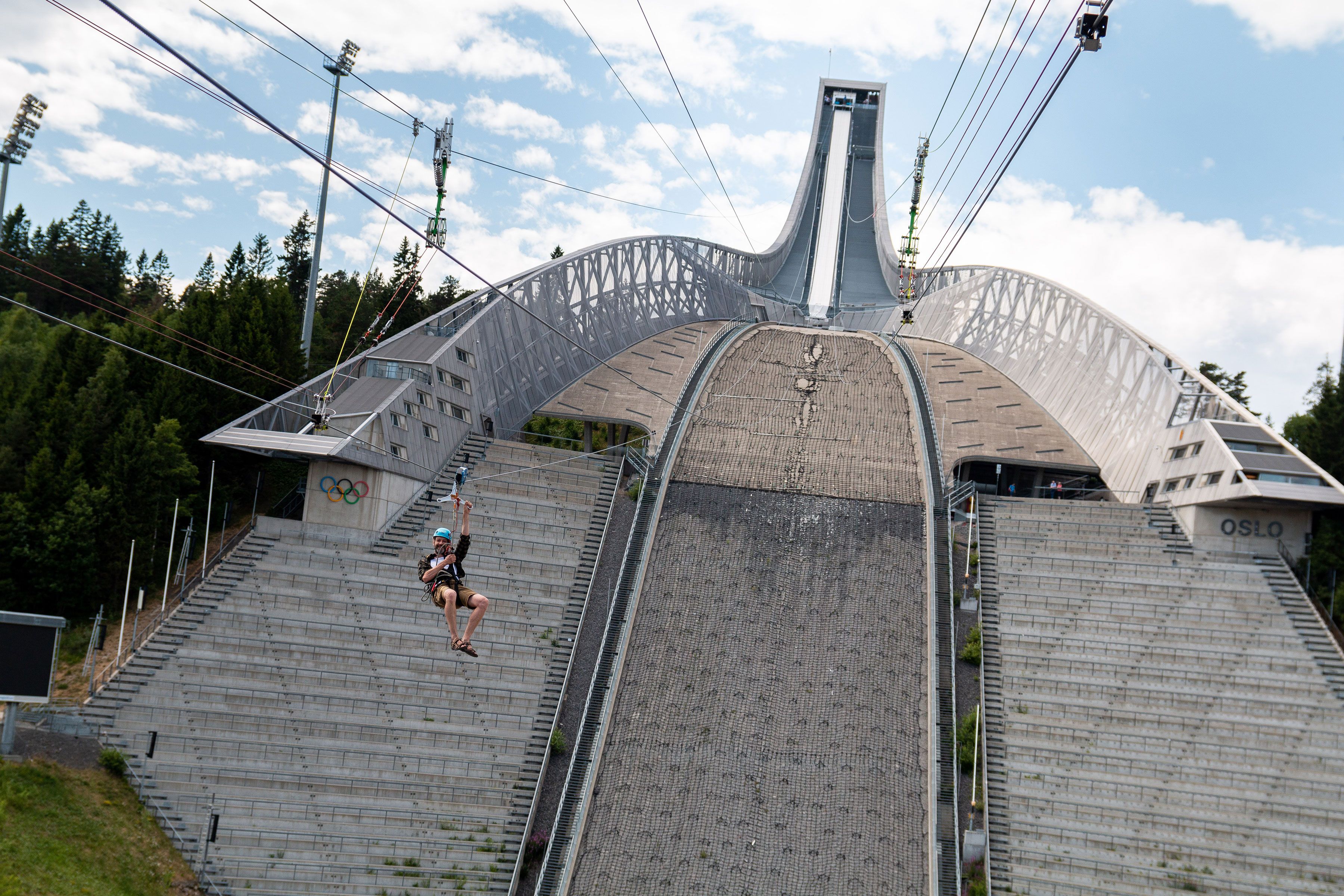 Person ziplining down Holmenkollen Ski Jump.