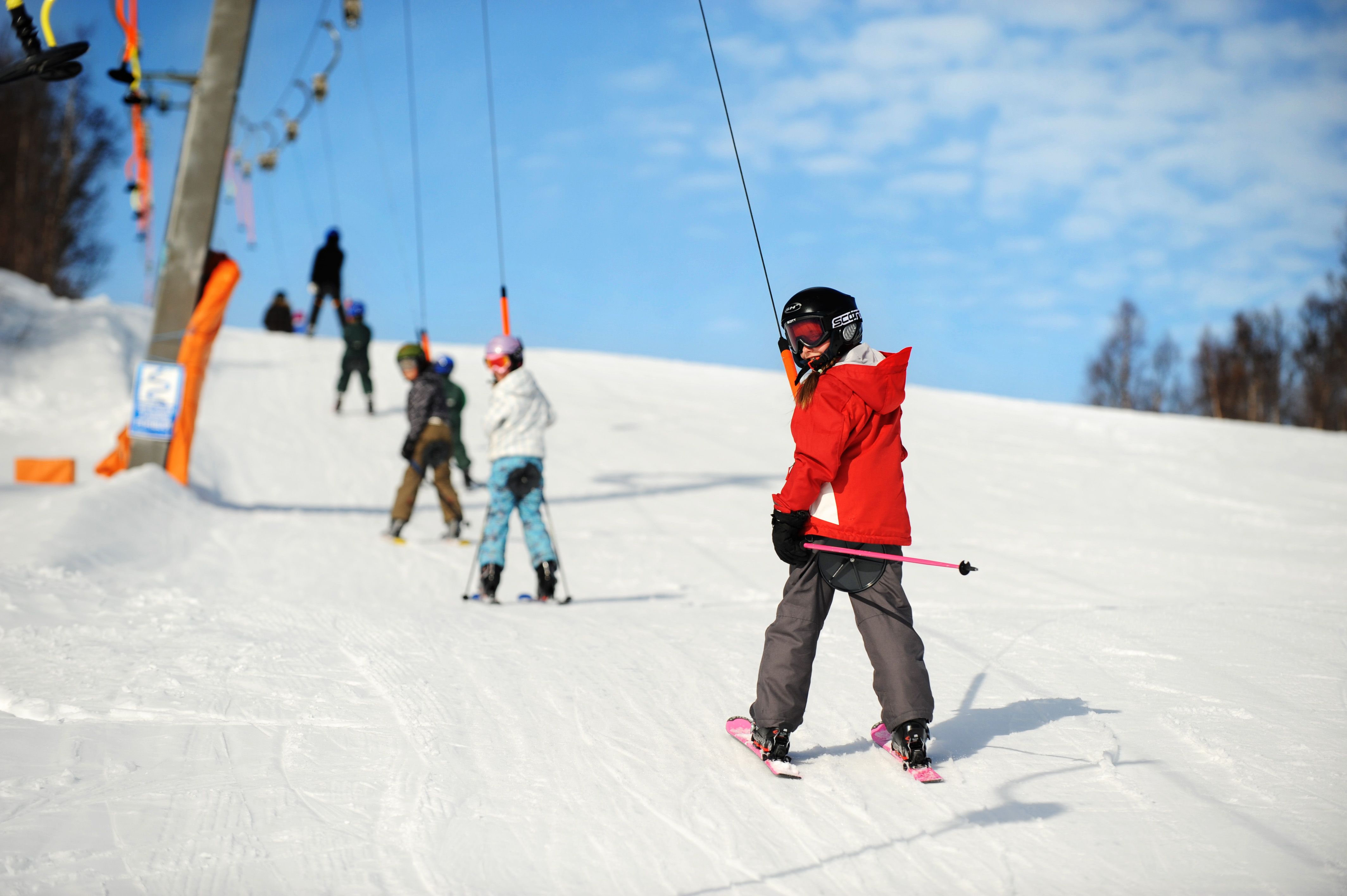 Children in the ski tow going uphill, photo
