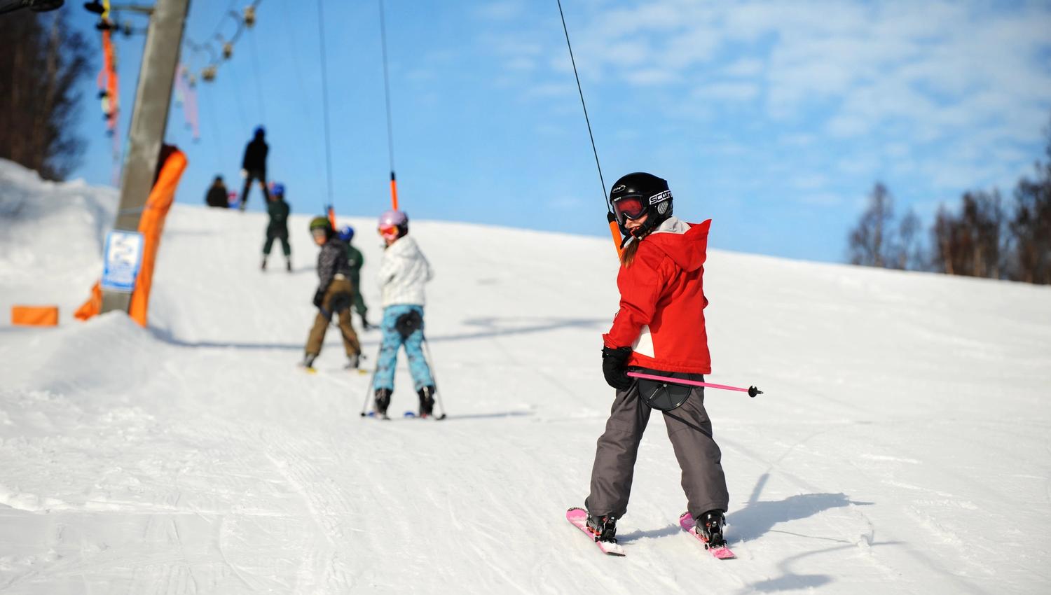 Children in the ski tow going uphill, photo