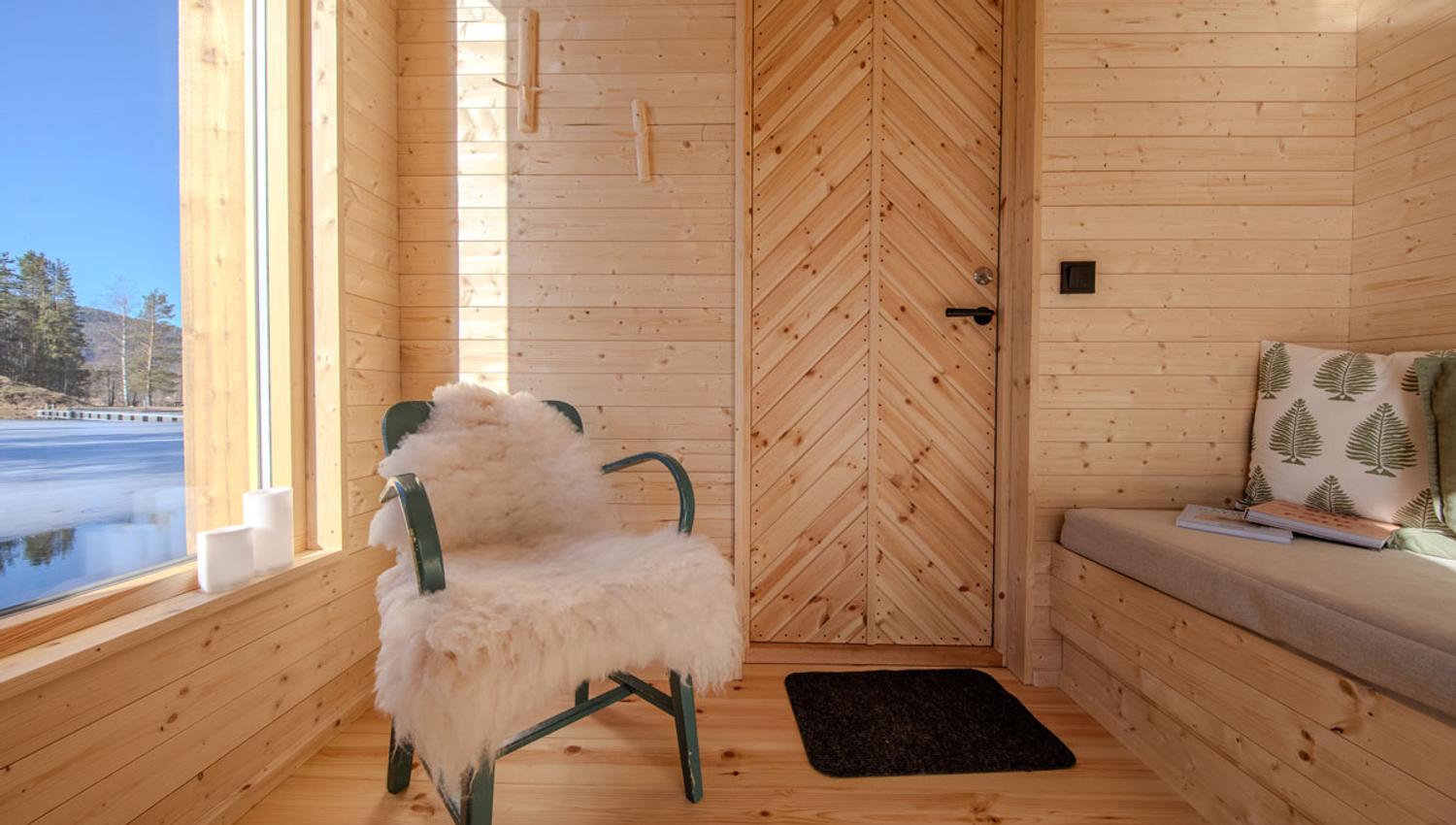 Cozy sitting area in the Forest Room Sauna